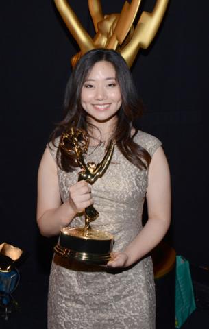 The Powerpuff Girls animator Jasmin Lai celebrates her win at the 2014 Primetime Creative Arts Emmys.