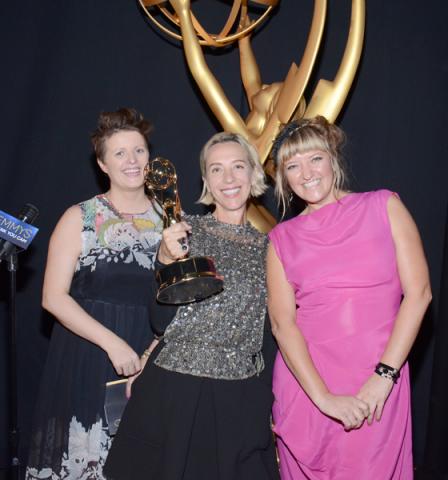Game of Thrones costume designers Nina Ayres (l), Michele Clapton (c), and Sheena Wichary (r) celebrate their win at the 2014 Primetime Creative Arts Emmys.