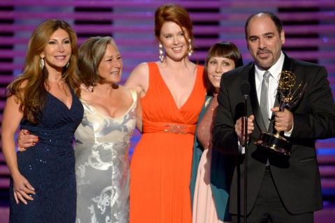 The makeup team for Saturday Night Live accepts an award at the 2014 Primetime Creative Arts Emmys.