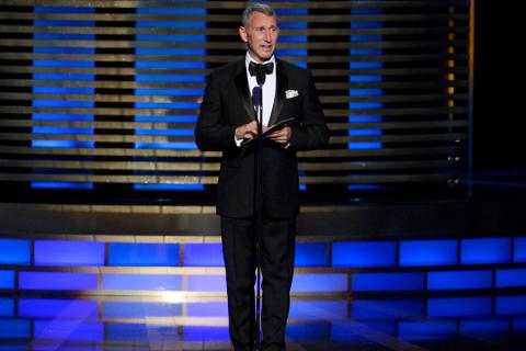 Adam Shankman presents an award at the 2014 Primetime Creative Arts Emmys.
