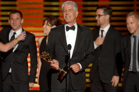 Anthony Bourdain and the team from Anthony Bourdain: Parts Unknown accept an award at the 2014 Primetime Creative Arts Emmys.