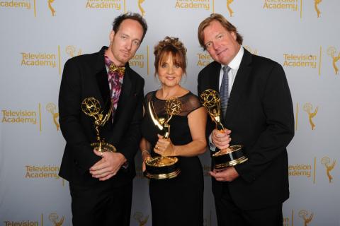 Dancing With the Stars camera operators Seth Saint Vincent (l), Bettina Levesque (c) and Mike Malone (r) celebrate their win at the 2014 Primetime Creative Arts Emmys.