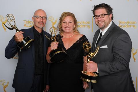 Dancing With the Stars lighting team members Simon Miles (l), Suzanne Sotelo (c) and Matthew Cotter (r) celebrate their win at the 2014 Primetime Creative Arts Emmys.