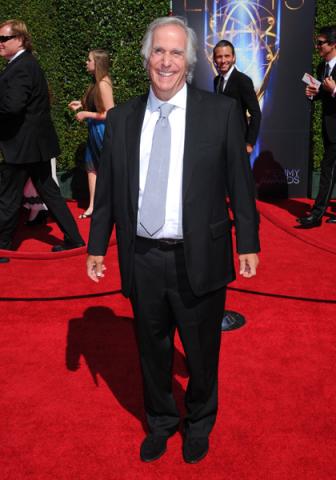 Henry Winkler arrives for the 2014 Primetime Creative Arts Emmys.