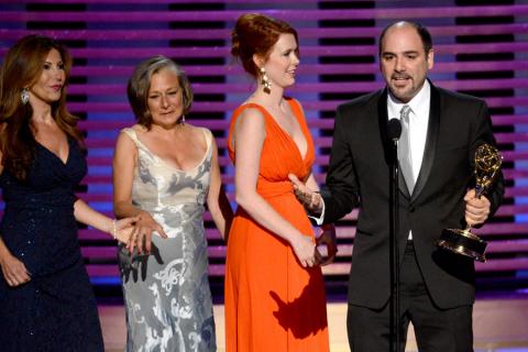 Saturday Night Live hairstylists (from left) Daniela Zivkovic, Melanie Demitri, Sarah Egan and Louie Zakarian accept an award at the 2014 Primetime Creative Arts Emmys.