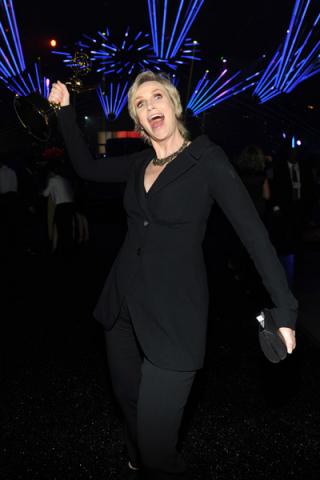 Hollywood Game Night winner Jane Lynch celebrates at the 2014 Creative Arts Emmys ball.