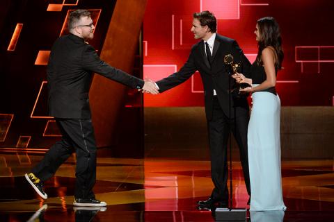 Josh Earl accepts his award from Peter Facinelli and Nina Dobrev at the 2015 Creative Arts Emmys.