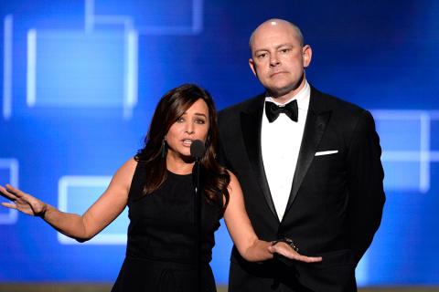 Pamela Adlon, left, and Rob Corddry presents an award at the 2015 Creative Arts Emmy Awards.