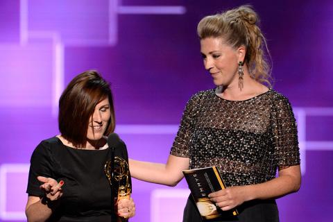 The team of Downton Abbey accepts their award at the 2015 Creative Arts Emmys.