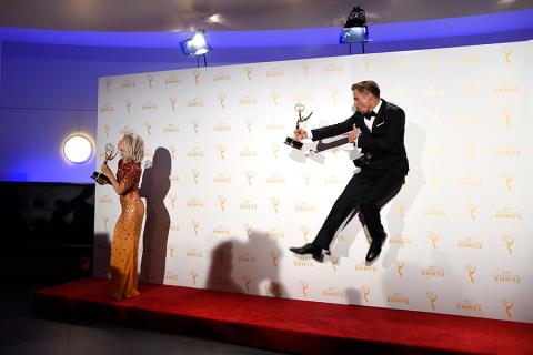 Derek Hough and Julianne Hough backstage at the 2015 Creative Arts Emmy Awards.