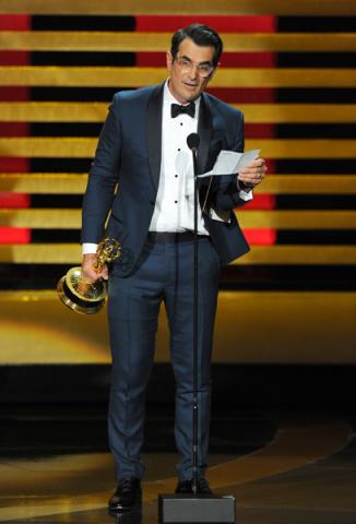 Ty Burrell of Modern Family accepts an award at the 66th Emmy Awards.