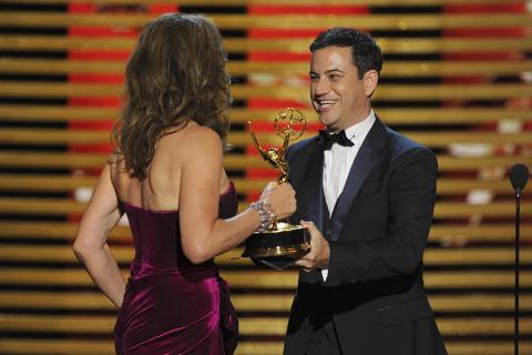 Jimmy Kimmel (r) presents an award to Allison Janney (l) of Mom.  