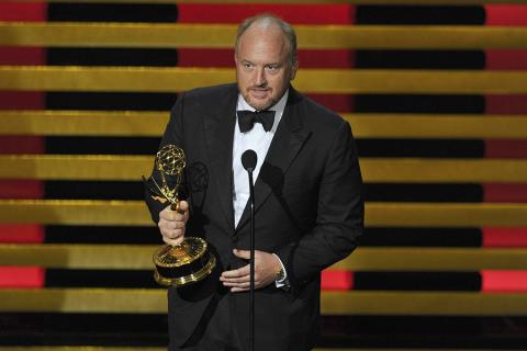 Louis C.K. accepts the award for outstanding writing for a comedy series for his work on Louie at the 66th Emmys.