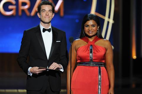 John Mulaney (l) and Mindy Kaling of The Mindy Project present an award at the 66th Emmy Awards.