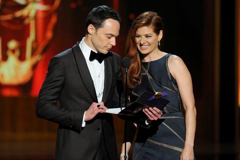 Jim Parsons of The Big Bang Theory and Debra Messing present an award at the 66th Emmys. 