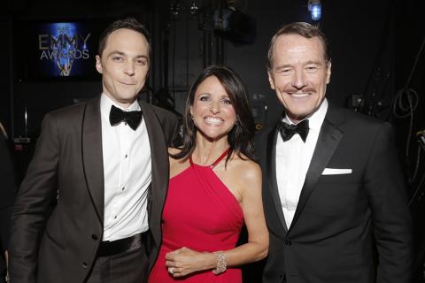 Jim Parsons (l), Julia-Louis Dreyfus (c) and Bryan Cranston (r) at the 66th Emmy Awards.