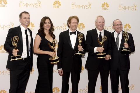 Jerry Bruckheimer (c) and the producers of The Amazing Race celebrate at the 66th Emmys.