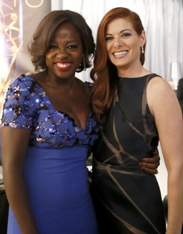 Viola Davis (l) and Debra Messing (r) at the 66th Emmys.