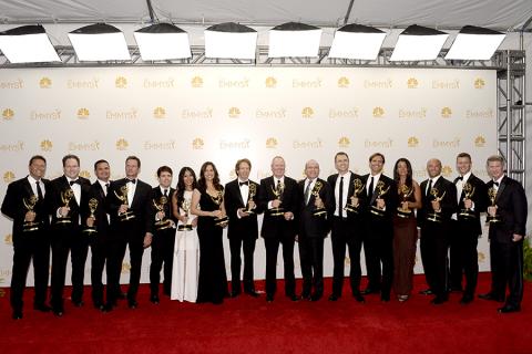 The producers of The Amazing Race celebrate at the 66th Emmy Awards.