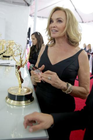Jessica Lange of American Horror Story celebrates at the 66th Emmys. 