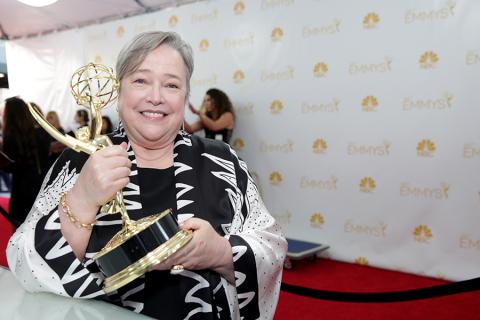 Kathy Bates of American Horror Story: Coven celebrates her win at the 66th Emmy Awards.