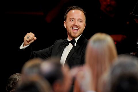 Aaron Paul of Breaking Bad celebrates at the 66th Emmys. 