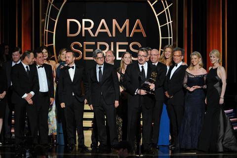 Vince Gilligan (c) and the cast and producers of Breaking Bad accept an award at the 66th Emmy Awards.