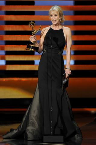 Breaking Bad writer Moira Walley-Beckett accepts an award at the 66th Emmy Awards.