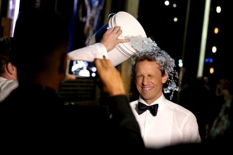 Seth Meyers of Late Night With Seth Meyers does the ALS ice bucket challenge backstage at the 66th Emmys. 