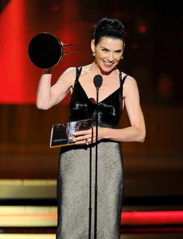 Julianna Margulies of The Good Wife accepts an award at the 66th Emmy Awards.