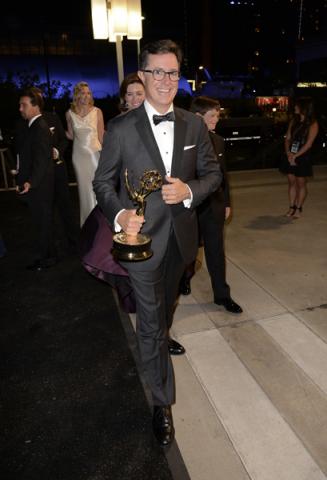 Stephen Colbert of The Colbert Report celebrates his win at the 66th Emmys Governors Ball.