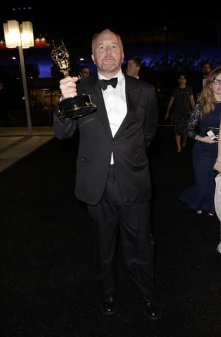 Louis CK of Louie celebrates his win at the 66th Emmys Governors Ball.
