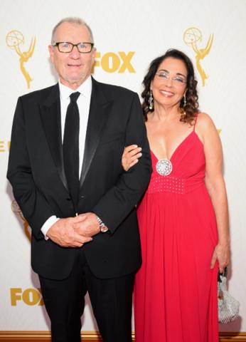 Ed O'Neill and Catherine Rusoff on the red carpet at the 67th Emmy Awards.
