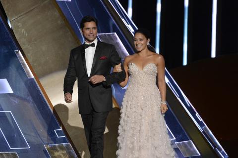 John Stamos and Gina Rodriguez at the 67th Primetime Emmy Awards.