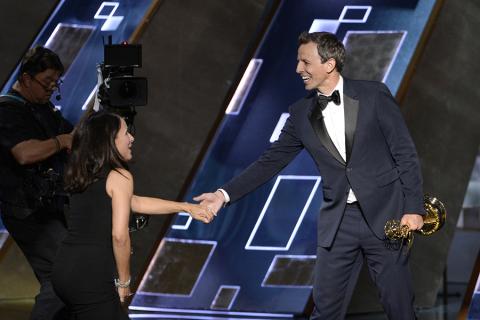 Seth Meyer presents Julia Louis-Dreyfus an award at the 67th Emmy Awards.