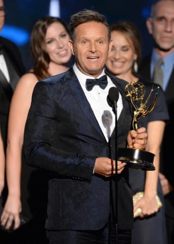 Mark Burnett accepts his award at the 67th Emmy Awards.