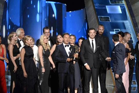 Mark Burnett and the team from "The Voice" accept an award at the 67th Emmy Awards.