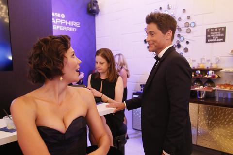 Maggie Gyllenhaal and Rob Lowe backstage at the 67th Emmy Awards.