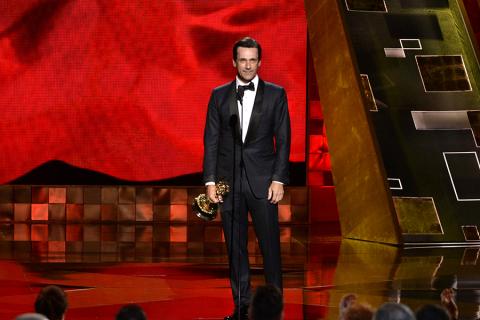 Jon Hamm accepts an award at the 67th Emmy Awards. 