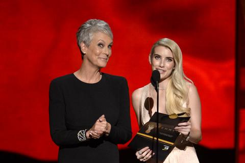Jamie Lee Curtis and Emma Roberts present an award at the 67th Emmy Awards.