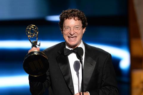 Chuck O'Neil accepts his award at the 67th Emmy Awards.