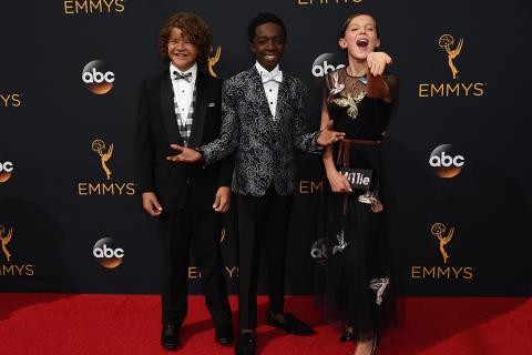 Gaten Matarazzo, Caleb McLaughlin, and Millie Bobby Brown on the red carpet at the 2016 Primetime Emmys. 