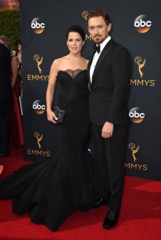 Neve Campbell and JJ Feild on the red carpet at the 2016 Primetime Emmys. 