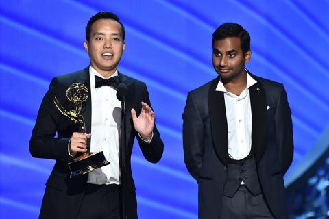 Kelvin Yu and Aziz Ansari accept their award at the 2016 Primetime Emmys.