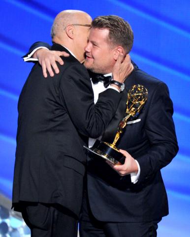 Jeffrey Tambor, left, accepts the award from James Corden at the 2016 Primetime Emmys.