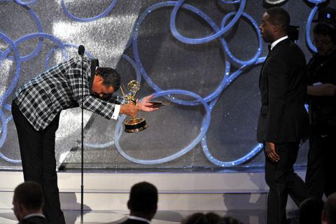 Terrence Howard, left, presents an award to Sterling K. Brown at the 2016 Primetime Emmys.
