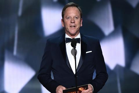 Kiefer Sutherland presents an award at the 2016 Primetime Emmys.