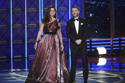 Debra Messing and Chris Hardwick present an award at the 2017 Primetime Emmys.