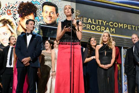 The team from The Voice accepts an award at the 69th Emmy Awards.