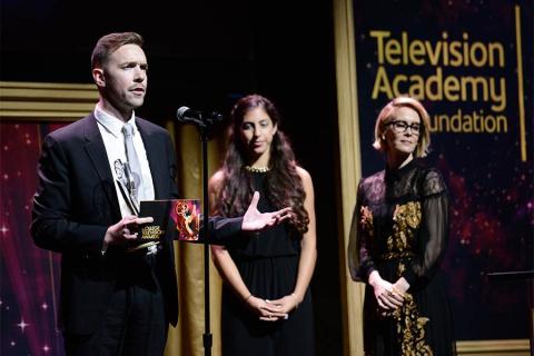 Henry Hughes accepts an award at the 36th College Television Awards at the Skirball Cultural Center in Los Angeles, California, April 23, 2015.